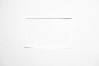 minimal background concept with white paper frame on blank white paper.