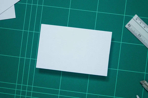 Top View Mock White Paper Green Cutting Mat Background —  Fotos de Stock