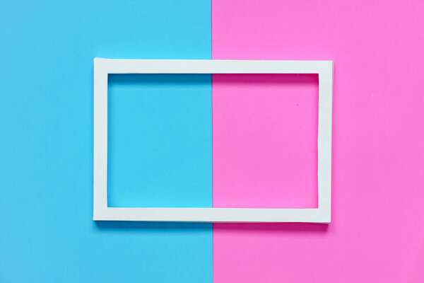 white paper frame on pink paper and blue paper