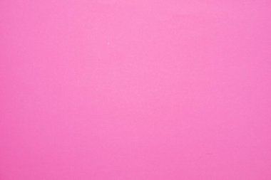 Arkaplan için boş pembe kağıt yüzeyi.