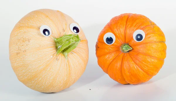 stock image Two ripe pumpkins with eyes