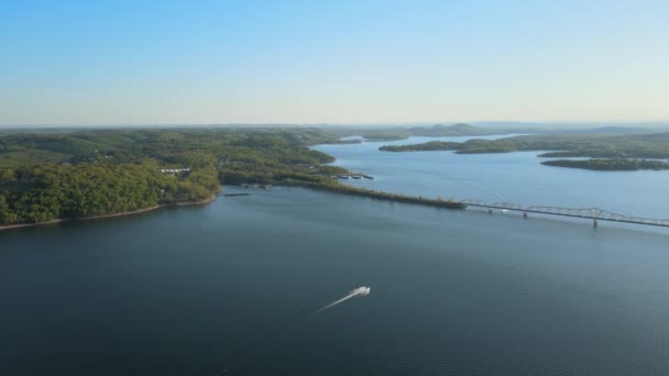 Aerial birds following view of a hige river bay and the green rainforest under the setting sun. — Stock Video