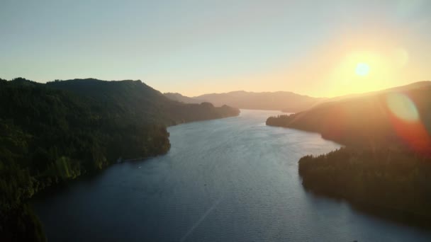 Birds-eye view of the sunrise over the river with hilly terrain. — Stock Video