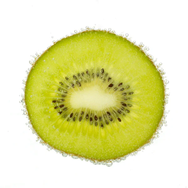 Nice slice of kiwi, covered with bubbles isolated on white. — Stock Photo, Image