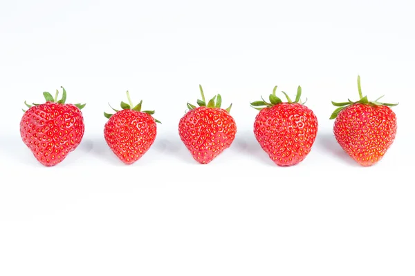 Grupo de cinco fresas aisladas en blanco — Foto de Stock