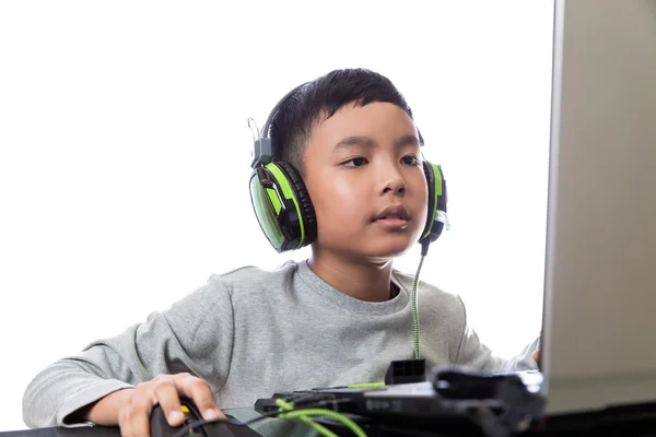 Asian kid play computer games — Stock Photo, Image