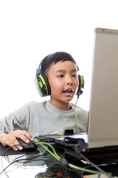 Asiatique enfant jouer à des jeux informatiques et parler avec un ami Images De Stock Libres De Droits