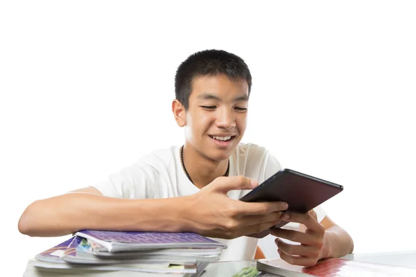 Asian teenager using his tablet or ipad and happy to find someth — Stock Photo, Image