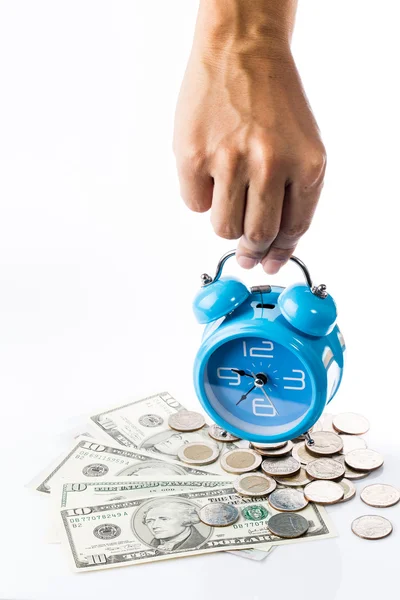 Single hand put alarm clock on pile of money — Stock Photo, Image