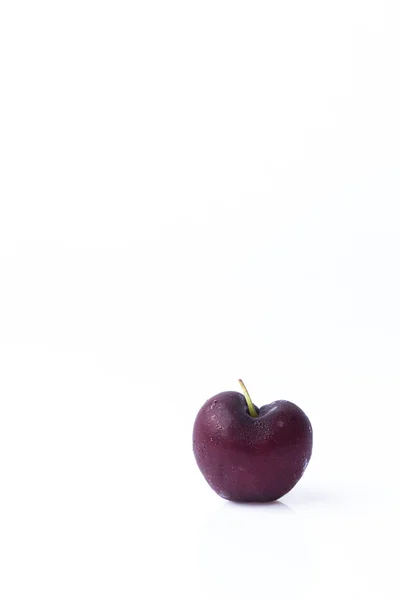 Cereza en forma de corazón sobre fondo blanco Fotos de stock