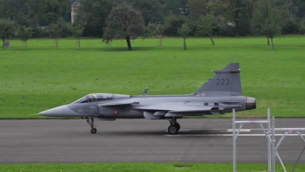 Fighter jet aircraft lines up on the runway for take-off in slow motion. — Stock Video