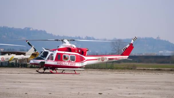 Firefighters red and white rescue helicopter ready to take off — Stock Video