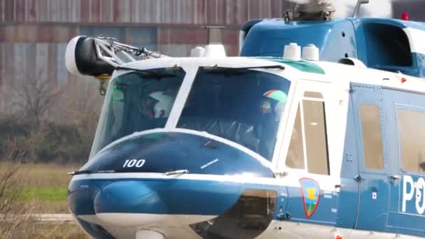 Police officers in the cabin of Agusta Bell AB-212 helicopter preparing for takeoff — Stock Video