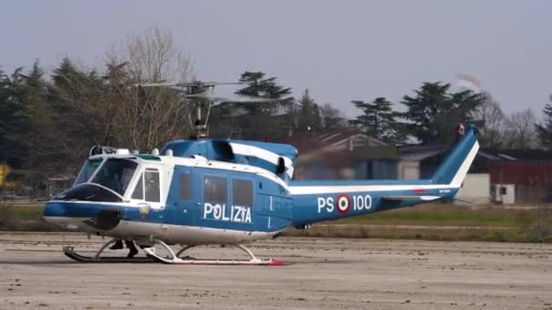 Police helicopter Agusta Bell AB-212 on the airport with spinning rotor — Stock Video
