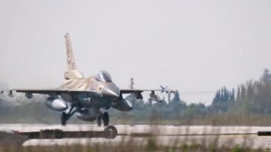 Armed combat jet plane takes off with full afterburner power