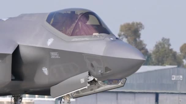Military combat stealth fighter jet pilot with special helmet in the cockpit — Stock Video