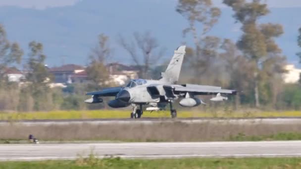 Fighter Jet slows down with spoilers and thrust reversers open after landing — Stock Video