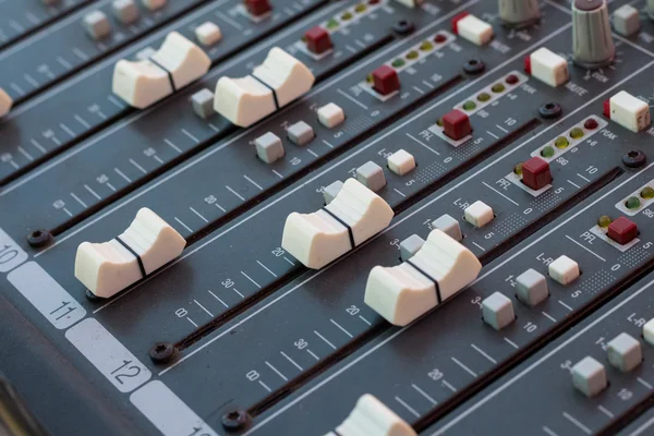 Part of an audio sound mixer with buttons and sliders — Stock Photo, Image