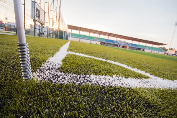 Artificial turf soccer field, a corner marker line — Stock Photo, Image