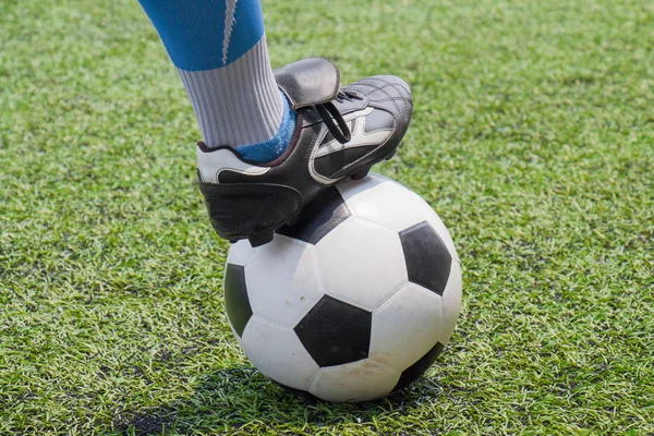 Soccer ball with his feet Stock Picture