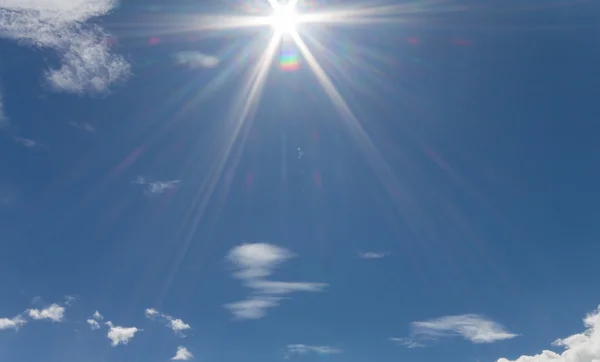 Lens Flare on the blue sky in cloudy days — Stock Photo, Image