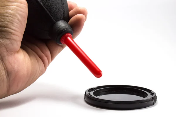Cleanning the lens cover by blower — Stock Photo, Image