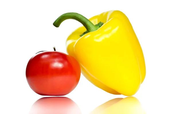 Red tomato and yellow pepper — Stock Photo, Image