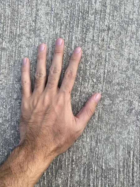 Close Man Hand Cement Floor — Foto de Stock