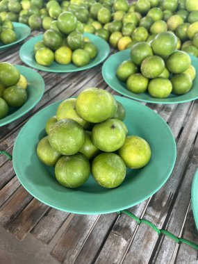 fresh ripe limes in market