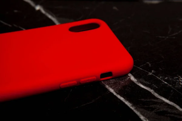 Colorful and silicone phone case placed on the floor, phone case image for e-commerce.