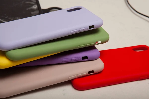 Colorful and silicone phone case placed on the floor, phone case image for e-commerce.