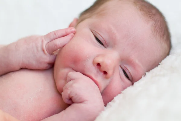 Newborn baby lying on a blanket — Stock Photo, Image