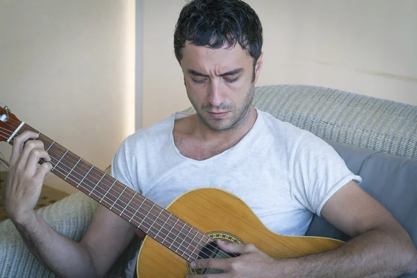 Attractive man playing spanish guitar — Stock Photo, Image