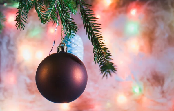 Christmas decorations on the branch. The background of the frosted glass. — Stock Photo, Image