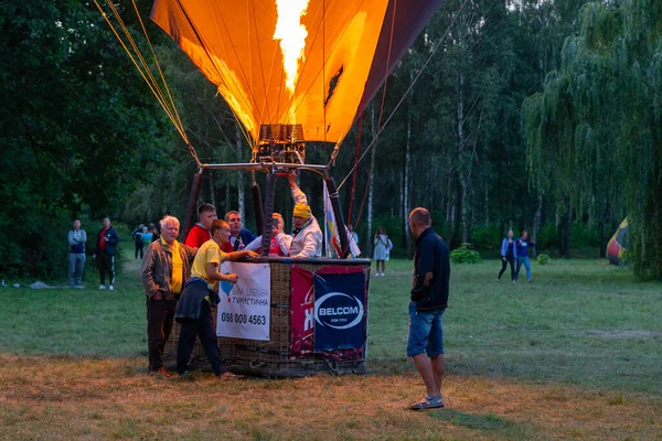 stock image Belaya Tserkov, Ukraine, August 24, 2020 A balloon with tourists in a basket is filled with hot air before the flight.