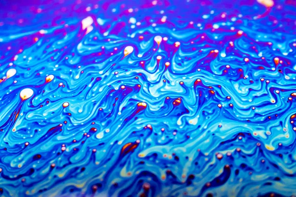 Beautiful psychedelic abstraction formed by light on the surface of a soap bubble.