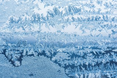 Cam, arkaplan dokusu üzerindeki soyut buz deseni.