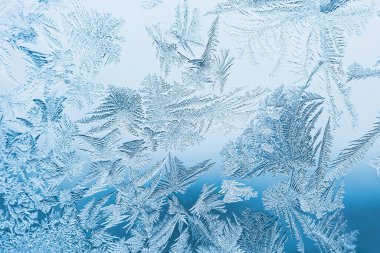 Cam, arkaplan dokusu üzerindeki soyut buz deseni.