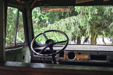 Steering wheel in an old disassembled abandoned car.