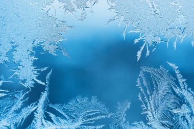 Cam, arkaplan dokusu üzerindeki soyut buz deseni.