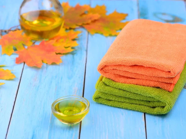 Fragrant oil for the procedure and towel — Stock Photo, Image