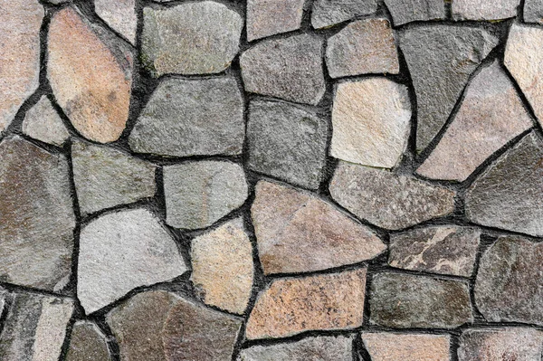 The pattern from the crushed stone at finishing works of socles or walls of buildings