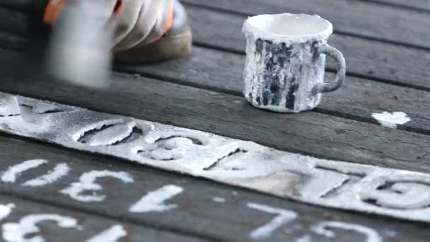 Workers  writing id numbers on steel blocks — Stock Video