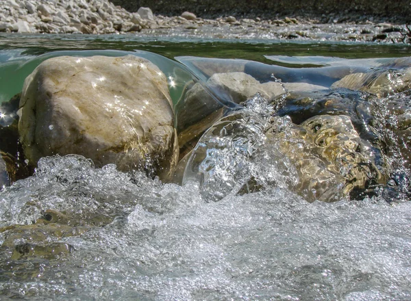 Stones over a running stream — Stock Photo, Image