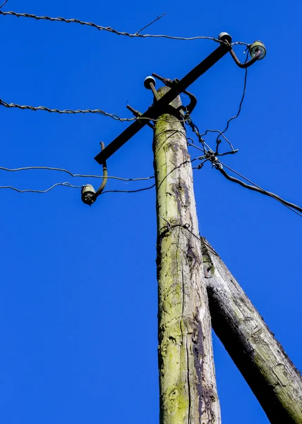 Old column with electric wires — Stock Photo, Image