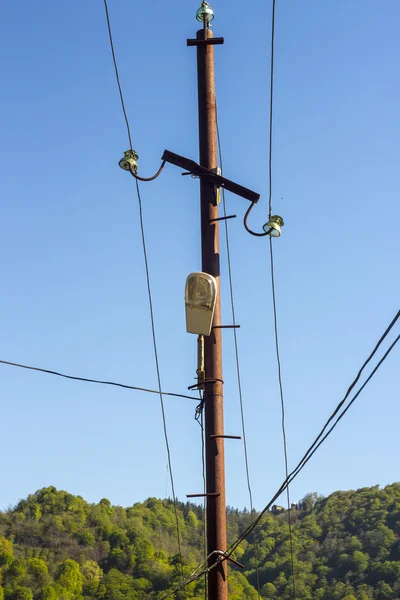 Old column with electric wires — Stock Photo, Image