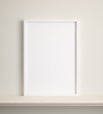 Bej duvarın yanındaki rafta 3 boyutlu bir poster çerçevesi var.