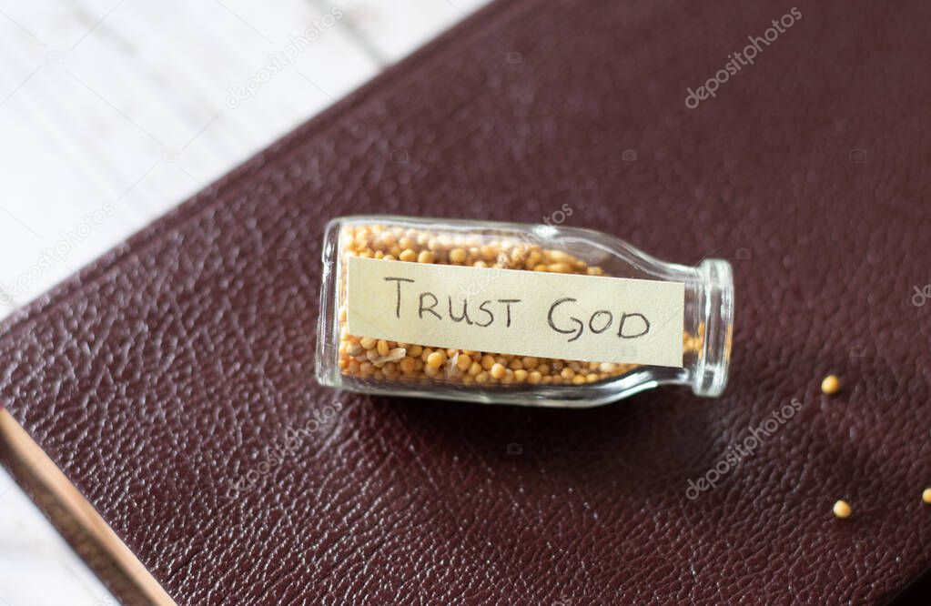 Complete trust in God and Jesus Christ/ Bottle with Bible verse full of mustard seed. Firm faith and hope in God's Word and His promises.