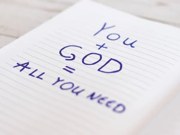God is all You need. Hopeful message on text paper page on wooden background. Bible-inspired concept. God is my stronghold shield fortress strength wisdom love. A covenant that lasts forever.