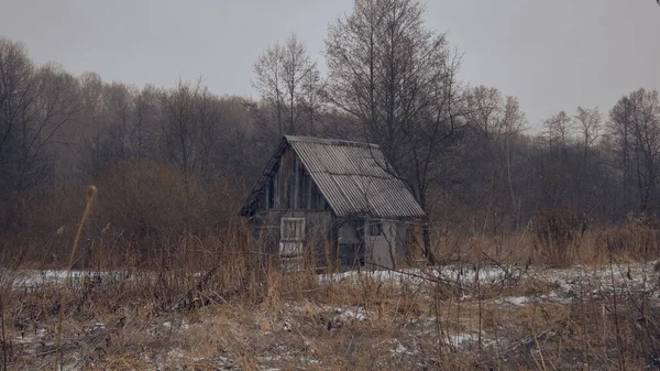 Lodge. Temporary old house. Winter landscape. Snow.